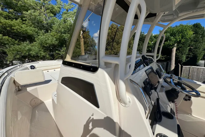  Yacht Photos Pics 2022 Grady-White Canyon 326 boat interior with steering console and seating area.