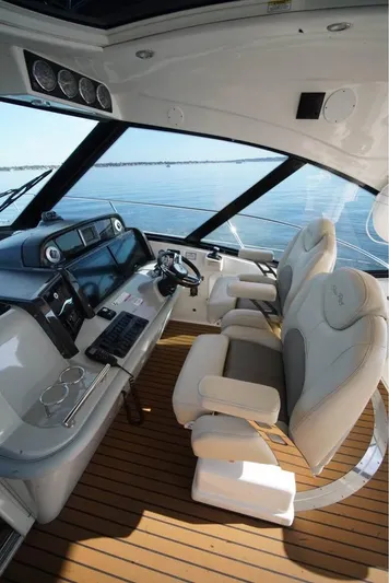  Yacht Photos Pics Luxurious 2012 Sea Ray 500 Sundancer helm with modern controls and plush seating.
