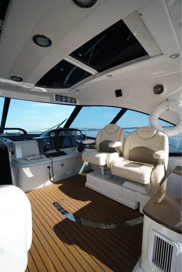  Yacht Photos Pics Luxurious interior of 2012 Sea Ray 500 Sundancer yacht with plush seating and modern controls.