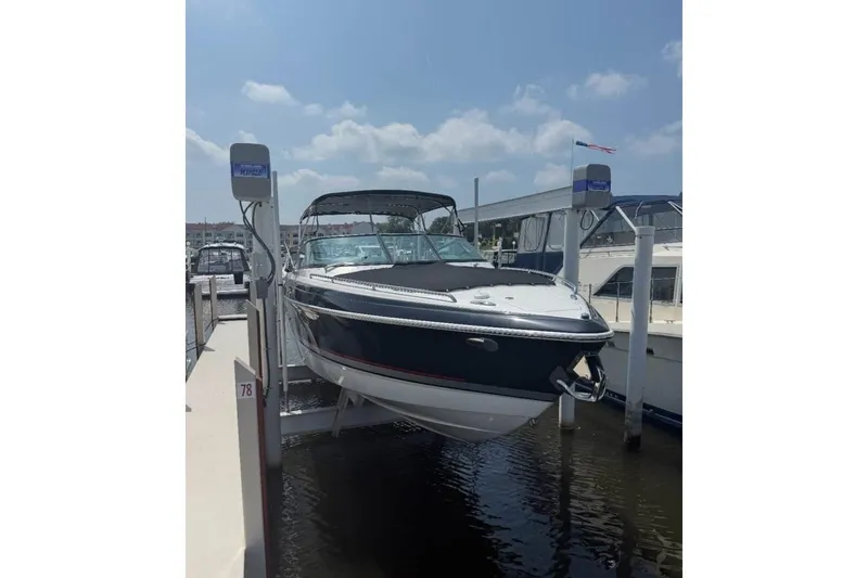  Yacht Photos Pics 2014 Formula 310 Bowrider boat docked at marina under clear sky.