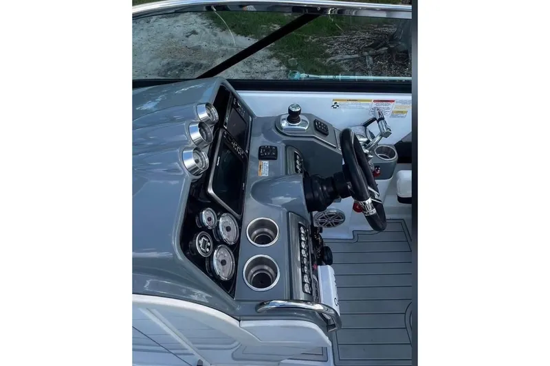  Yacht Photos Pics 2014 Formula 310 Bowrider dashboard with steering wheel and control panel.