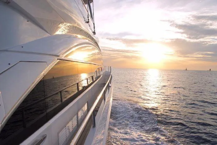  Yacht Photos Pics Luxurious 2014 Princess 82 yacht cruising at sunset on open sea.