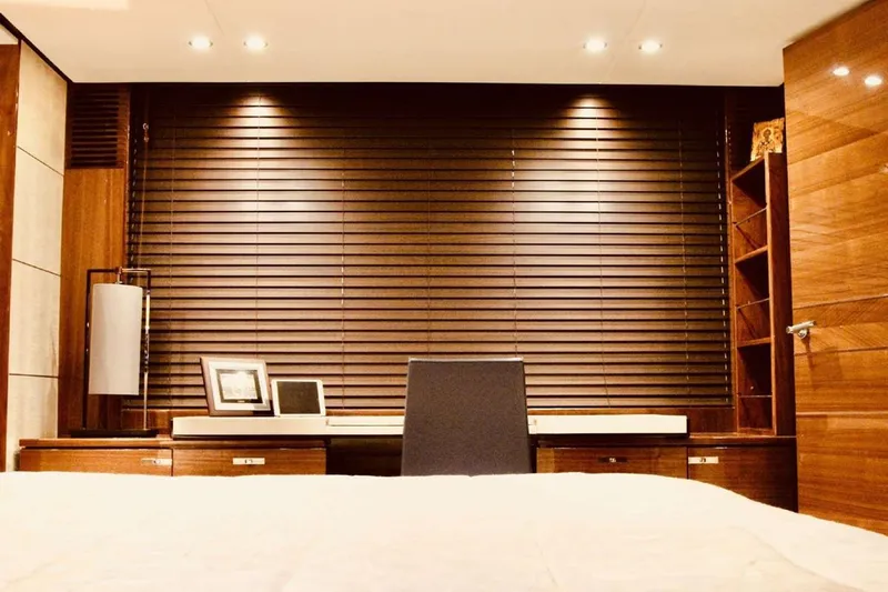  Yacht Photos Pics Luxurious yacht interior with wooden blinds, desk, and modern decor, Princess 82, 2014 model.