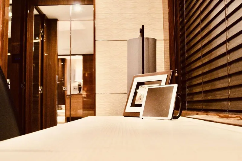  Yacht Photos Pics Luxurious yacht interior with framed photos, wooden blinds, and elegant decor, Princess 82, 2014.