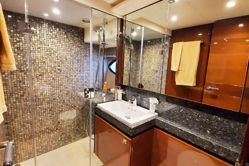  Yacht Photos Pics Luxurious bathroom in 2014 Princess 82 yacht with modern fixtures and mosaic tiles.
