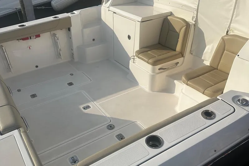  Yacht Photos Pics 2018 Pursuit OS 355 Offshore boat interior with beige seating and spacious deck.