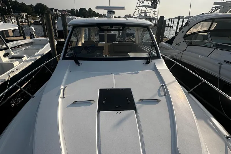  Yacht Photos Pics 2018 Pursuit OS 355 Offshore boat docked at marina, front view.