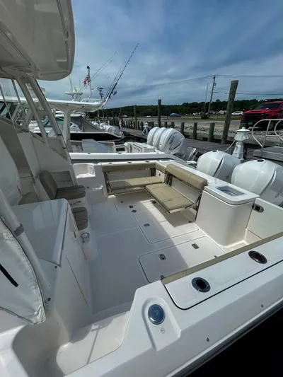  Yacht Photos Pics 2018 Pursuit OS 355 Offshore boat interior with seating and fishing equipment.