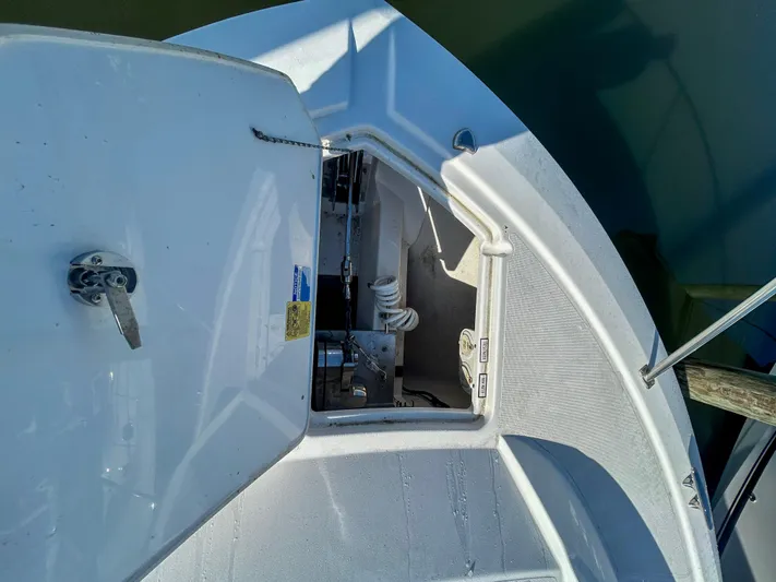  Yacht Photos Pics 2018 Pursuit OS 355 Offshore boat anchor compartment, open hatch view.