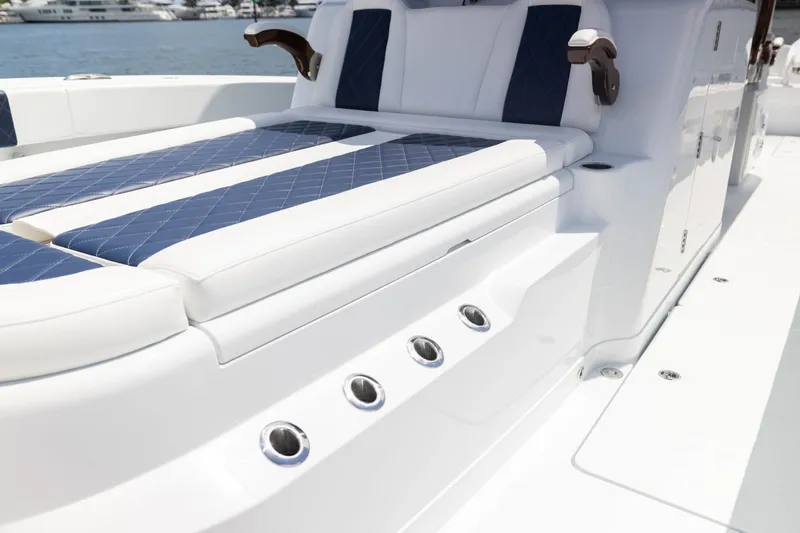  Yacht Photos Pics Luxurious seating on 2026 Freeman 47 LX boat with blue and white upholstery.