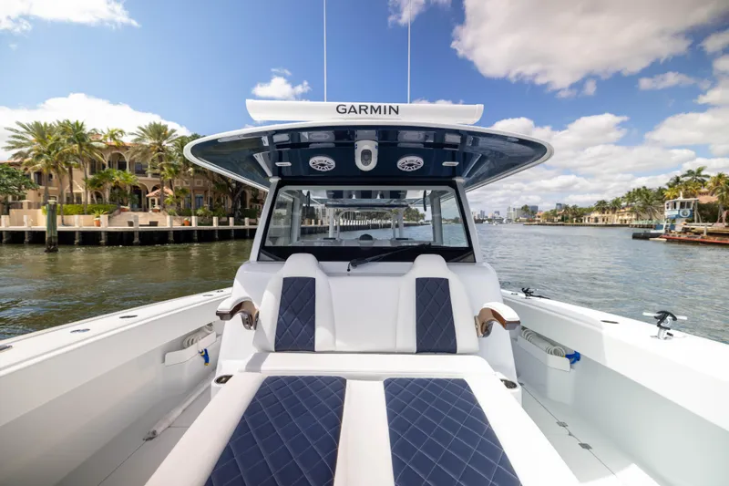  Yacht Photos Pics Freeman 47 LX 2026 boat interior with luxurious seating on a sunny waterfront.