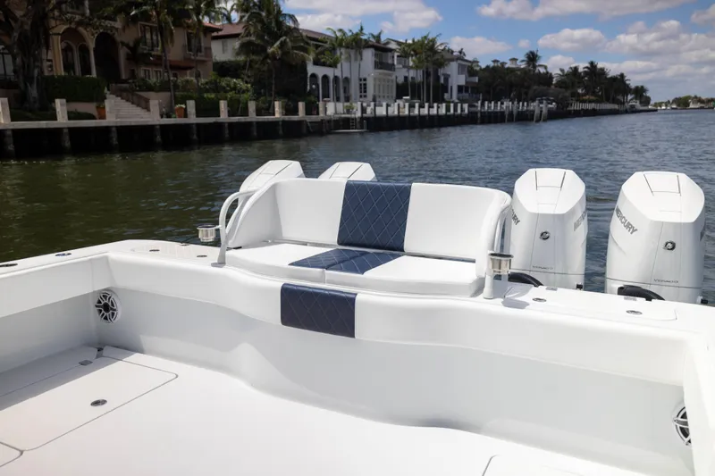  Yacht Photos Pics 2026 Freeman 47 LX boat with luxurious seating and powerful Mercury engines on a scenic waterway.