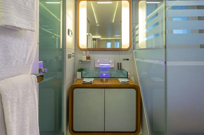 Mondomarine 138' Yacht Photos Pics Luxurious bathroom on 2008 Mondomarine 138 yacht with modern glass sink and elegant lighting.