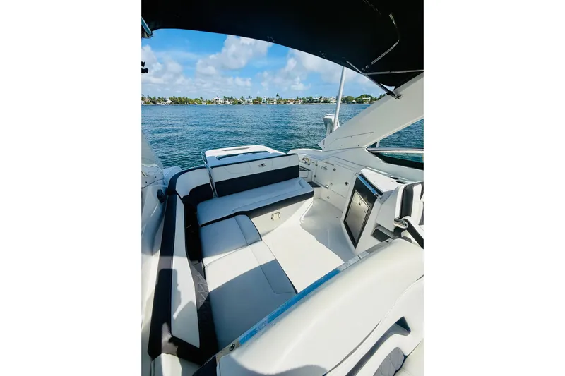  Yacht Photos Pics 2020 Monterey 328SS Super Sport boat interior with seating, overlooking calm waters.