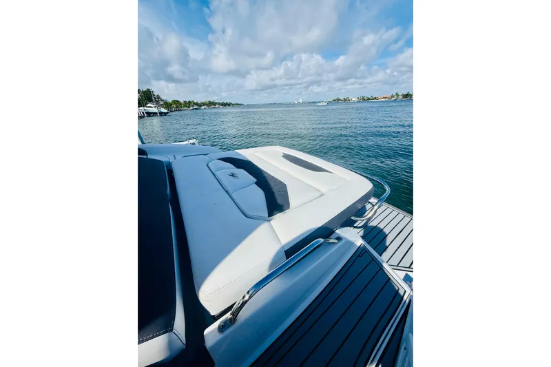  Yacht Photos Pics 2020 Monterey 328SS Super Sport boat on serene water with clear sky.