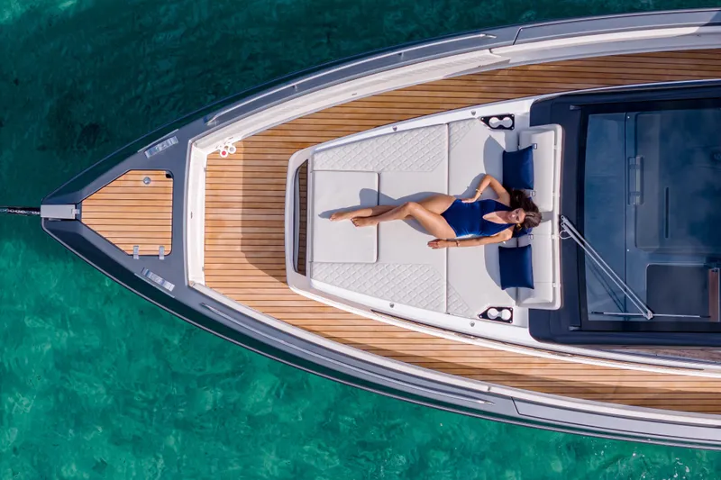  Yacht Photos Pics Aerial view of a 2025 Schaefer V44 yacht with a person sunbathing on deck.