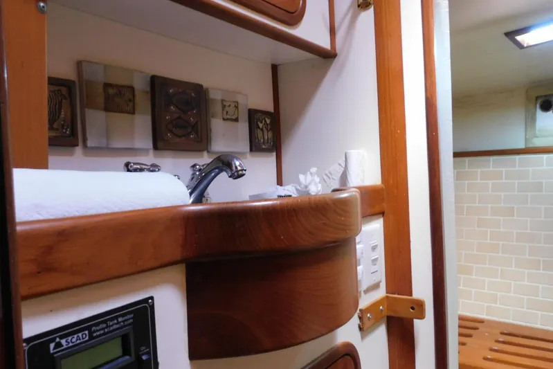 Popeye Yacht Photos Pics Interior of 1988 Hans Christian 45 Independence Trawler, featuring wooden cabinetry and modern fixtures.