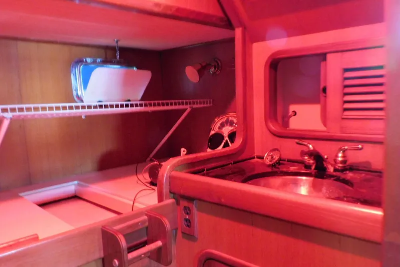 Popeye Yacht Photos Pics 1988 Hans Christian 45 Independence Trawler interior with sink and storage shelves.