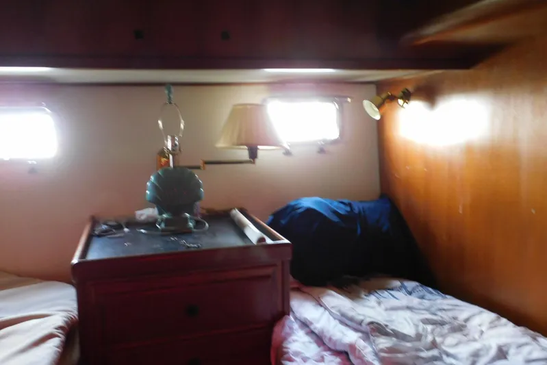 Popeye Yacht Photos Pics Cozy cabin interior of 1988 Hans Christian 45 Independence Trawler with beds and lamps.