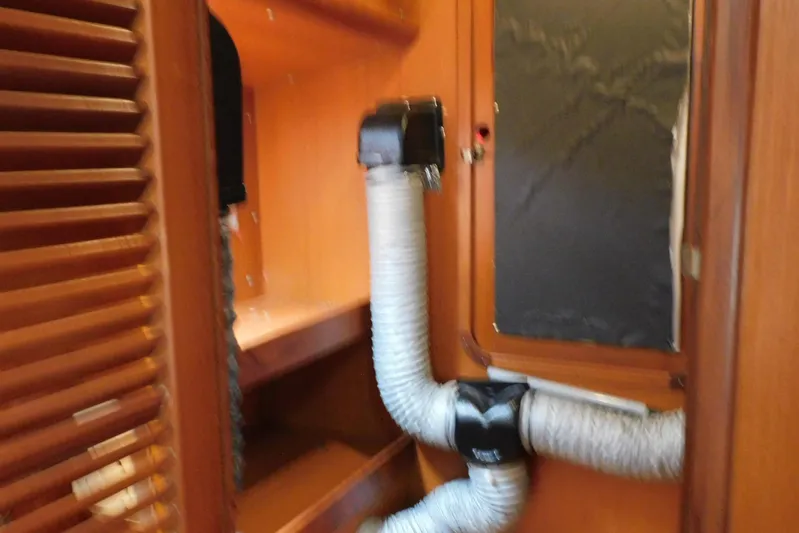 Popeye Yacht Photos Pics Interior of 1988 Hans Christian 45 Independence Trawler with ventilation system and wooden cabinetry.