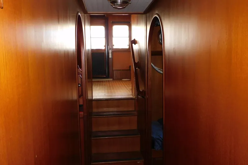 Popeye Yacht Photos Pics Interior of 1988 Hans Christian 45 Independence Trawler with wooden walls and stairs.