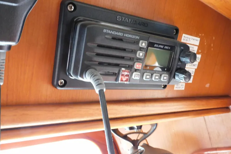 Popeye Yacht Photos Pics VHF radio on 1988 Hans Christian 45 Independence Trawler, mounted on wooden panel.