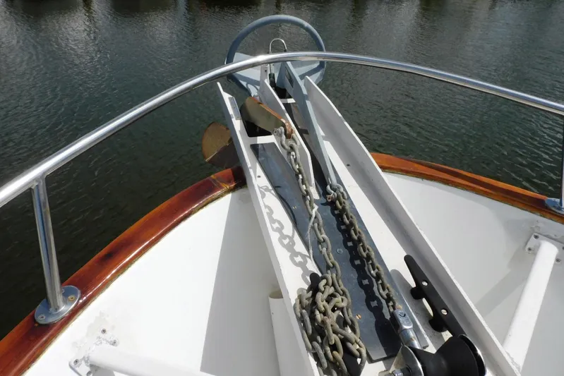 Popeye Yacht Photos Pics Bow of 1988 Hans Christian 45 Independence Trawler with anchor chain and railing.