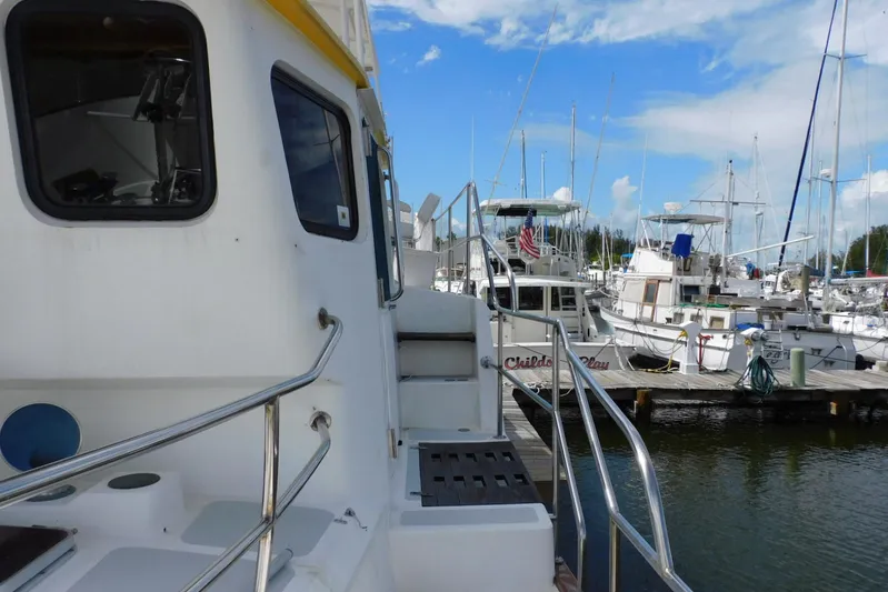 Popeye Yacht Photos Pics 1988 Hans Christian 45 Independence Trawler docked at marina, surrounded by other boats.