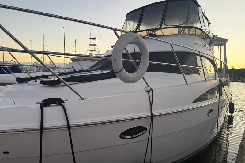 Y-knot Yacht Photos Pics 2007 Meridian 459 Motoryacht docked at sunset, featuring sleek design and spacious deck.