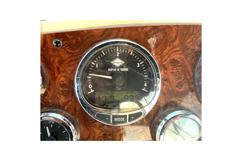 Y-knot Yacht Photos Pics Dashboard of 2007 Meridian 459 Motoryacht with RPM gauge and wood finish.