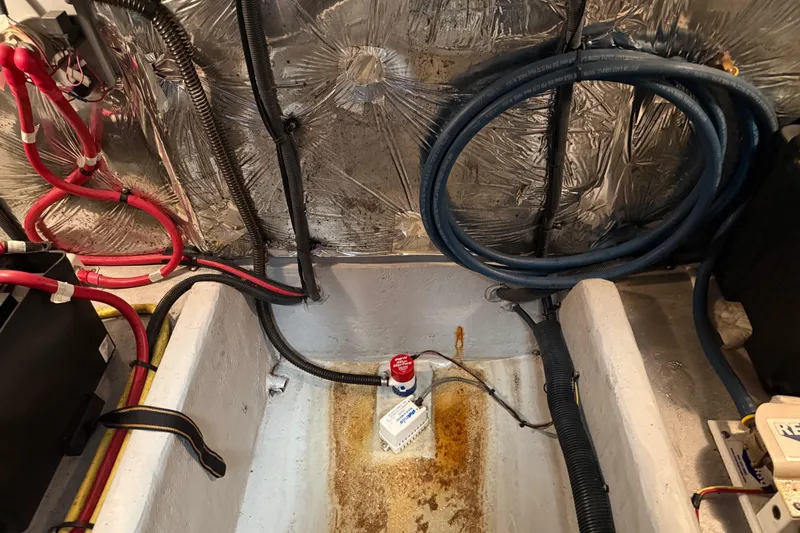 Y-knot Yacht Photos Pics Engine room of a 2007 Meridian 459 Motoryacht with wiring and insulation.