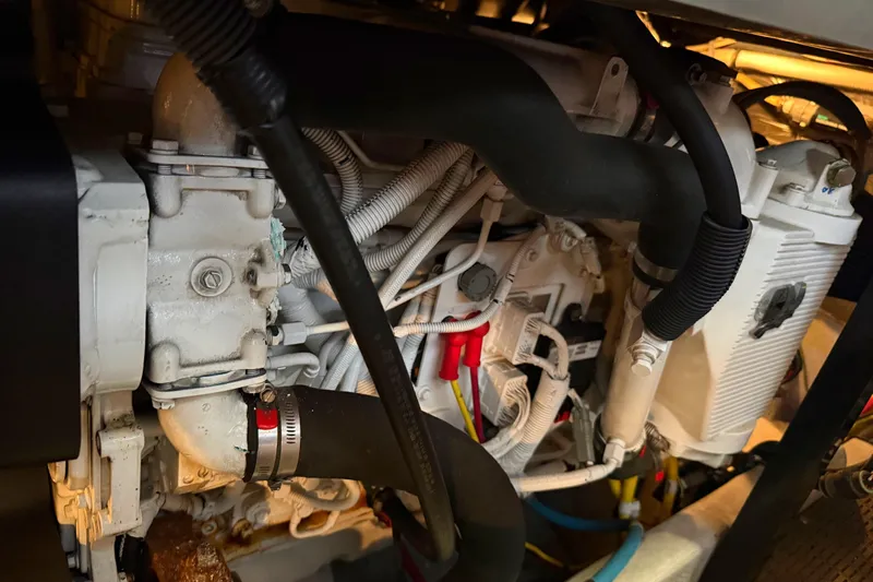 Y-knot Yacht Photos Pics Engine compartment of a 2007 Meridian 459 Motoryacht, showcasing intricate mechanical components.