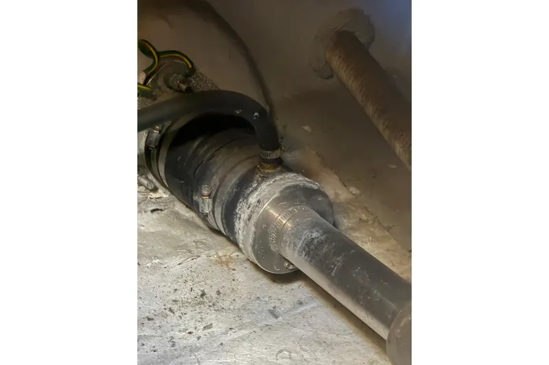 Y-knot Yacht Photos Pics 2007 Meridian 459 Motoryacht engine component with hoses and fittings.