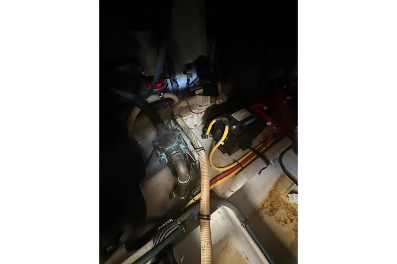 Y-knot Yacht Photos Pics Engine room of 2007 Meridian 459 Motoryacht with visible wiring and components.