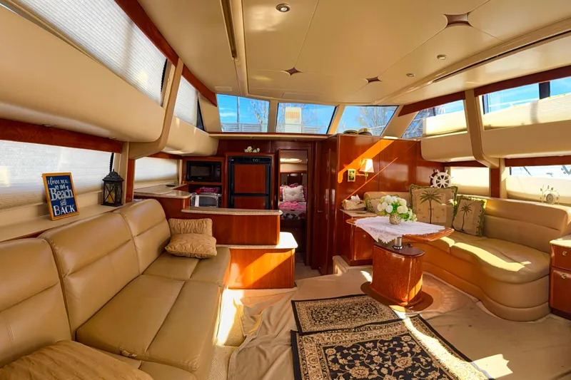 Y-knot Yacht Photos Pics Luxurious interior of a 2007 Meridian 459 Motoryacht with elegant seating and decor.