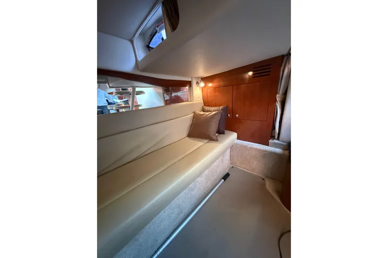  Yacht Photos Pics Interior of 2007 Sea Ray 340 yacht with beige seating and wooden cabinetry.