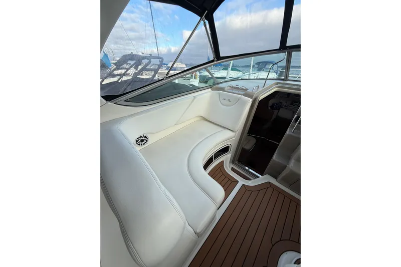  Yacht Photos Pics Interior of a 2007 Sea Ray 340 boat with white seating and wood flooring.