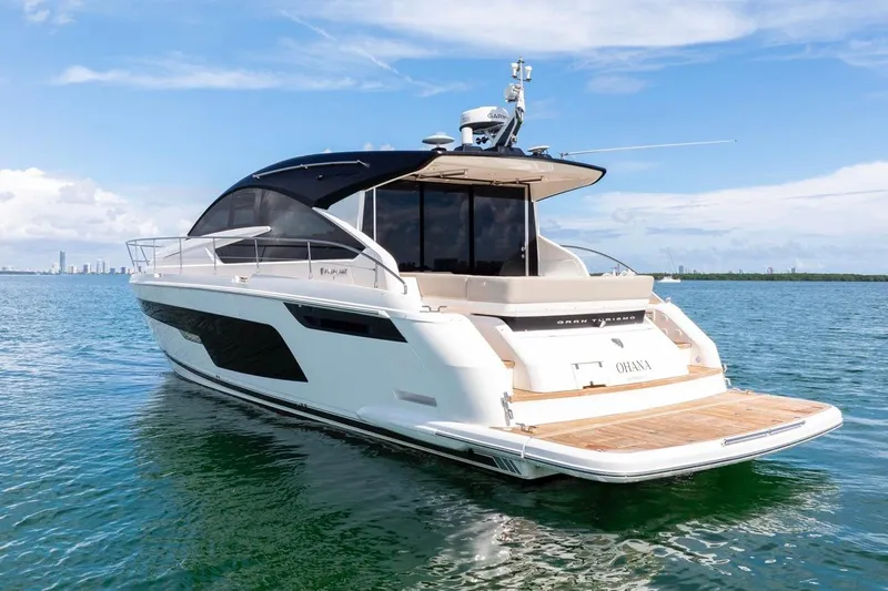  Yacht Photos Pics 2024 Fairline Targa 50 GT yacht on calm blue water, showcasing sleek design.
