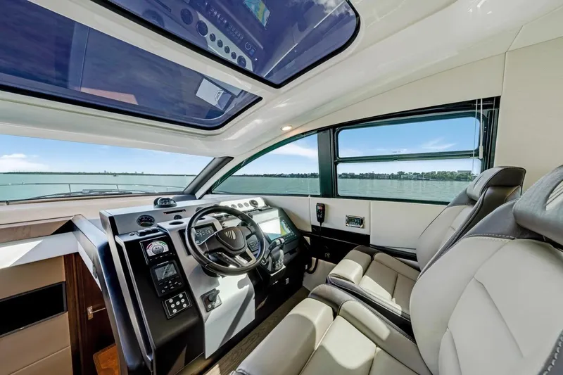  Yacht Photos Pics 2024 Fairline Targa 50 GT yacht interior with modern helm and panoramic windows.