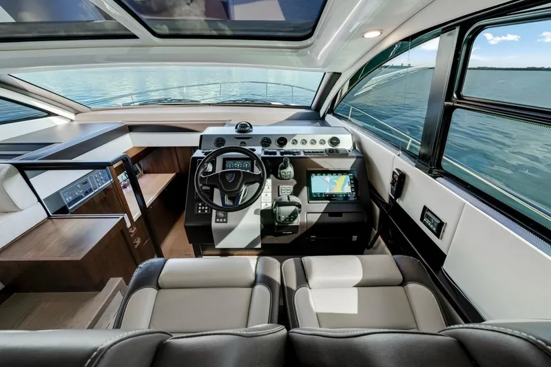  Yacht Photos Pics Interior of 2024 Fairline Targa 50 GT yacht, featuring modern helm and navigation systems.