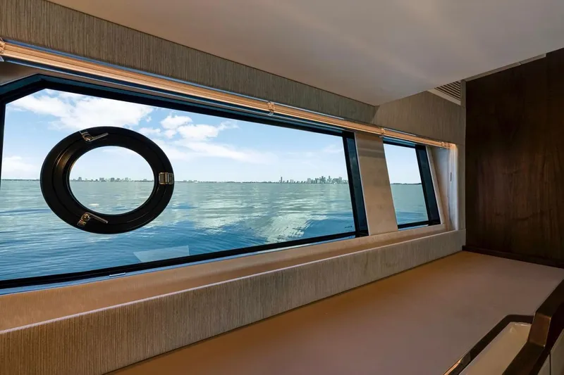  Yacht Photos Pics 2024 Fairline Targa 50 GT interior with ocean view through large window.
