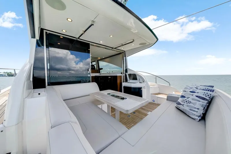  Yacht Photos Pics 2024 Fairline Targa 50 GT yacht with luxurious outdoor seating and ocean view.