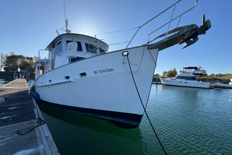 Kallisto Yacht Photos Pics 1982 Kadey-Krogen Krogen 42 Trawler docked at marina, sunny day.