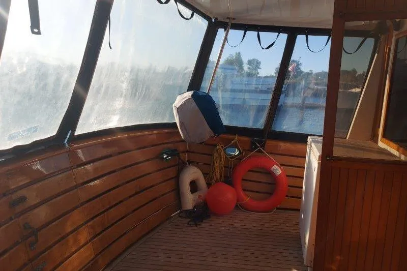 Kallisto Yacht Photos Pics 1982 Kadey-Krogen Krogen 42 Trawler interior with life rings and wooden paneling.