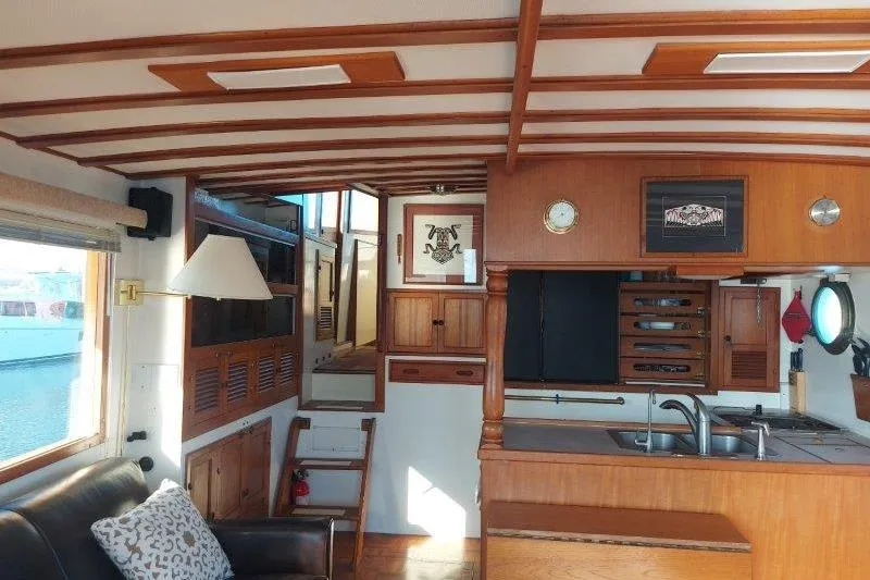 Kallisto Yacht Photos Pics Interior of 1982 Kadey-Krogen Krogen 42 Trawler with wooden cabinetry and nautical decor.