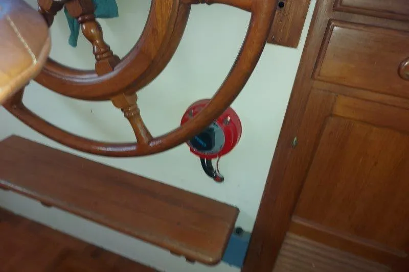 Kallisto Yacht Photos Pics Wooden steering wheel and panel on 1982 Kadey-Krogen Krogen 42 Trawler boat.