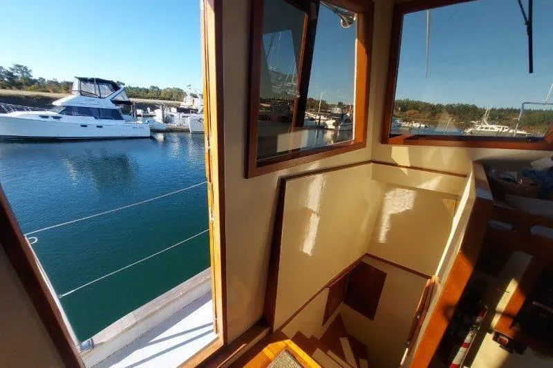 Kallisto Yacht Photos Pics Interior view of 1982 Kadey-Krogen Krogen 42 Trawler with marina backdrop.