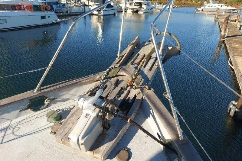 Kallisto Yacht Photos Pics 1982 Kadey-Krogen Krogen 42 Trawler bow with anchor, docked in marina.
