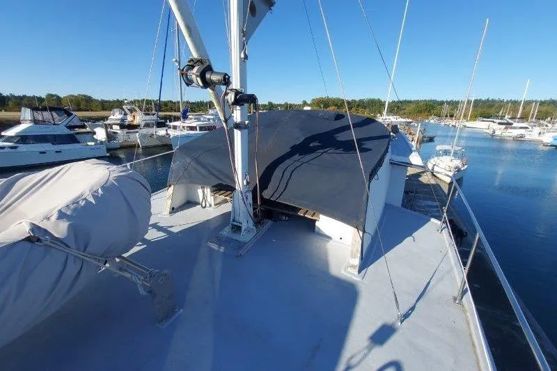 Kallisto Yacht Photos Pics 1982 Kadey-Krogen Krogen 42 Trawler docked in a marina under clear blue skies.