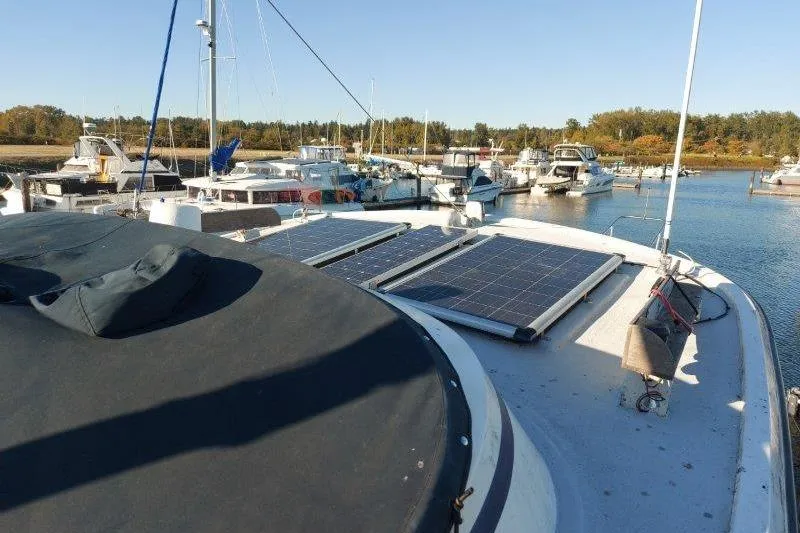Kallisto Yacht Photos Pics 1982 Kadey-Krogen Krogen 42 Trawler with solar panels docked in a marina.